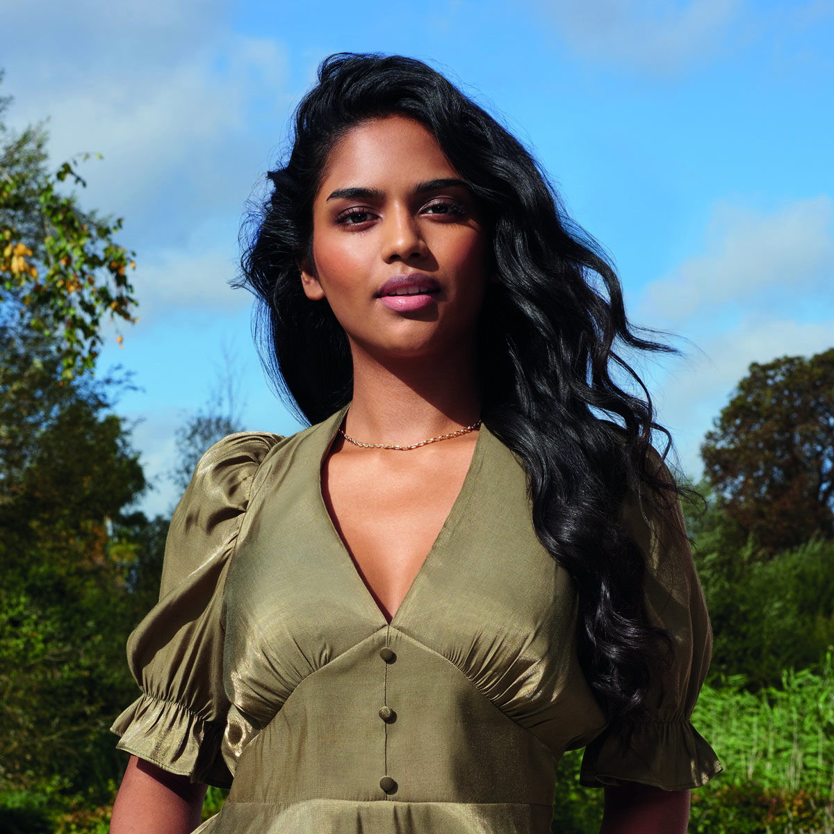 Model with hair styled using Titanium Brilliance Conical Wand